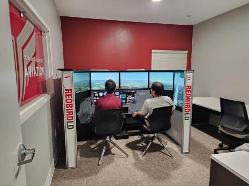 Schreiner University Pilot Program redbird simulator training with student