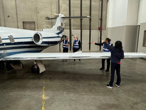 Atlanta Georgia A&P Mechanic Training students working on wing of learjet